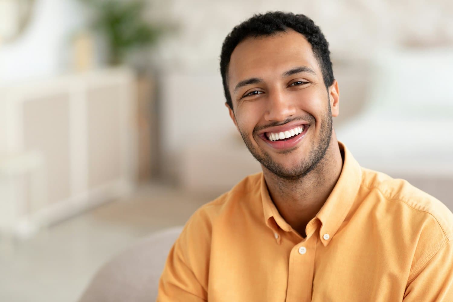 Teenager with a confident smile wearing Invisalign Teen aligners